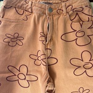 I’m seeking long orange retro flare pants that come from the brand Bailey Rose.